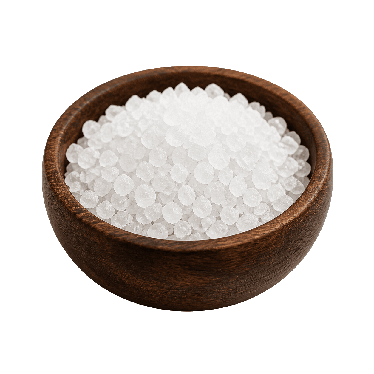 Coarse salt in a dark wooden bowl